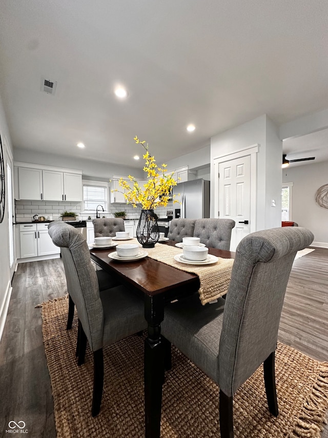 dining room with dark hardwood / wood-style floors