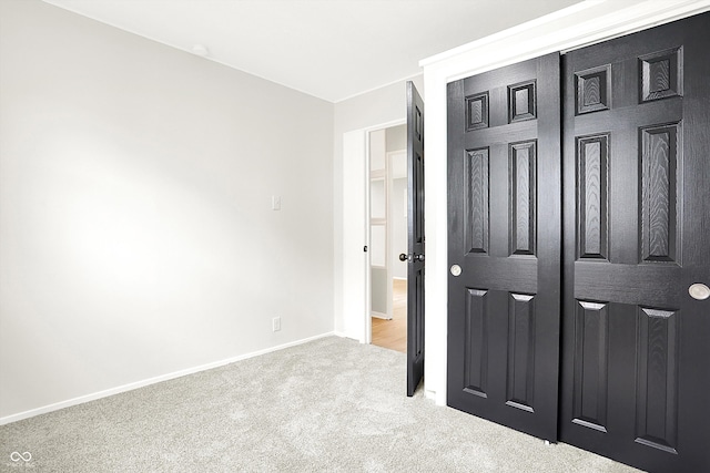 carpeted bedroom featuring a closet