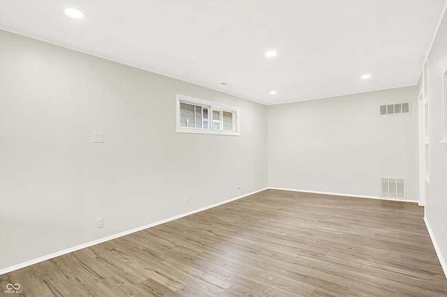 spare room featuring light hardwood / wood-style floors