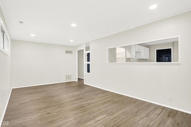 empty room with wood-type flooring