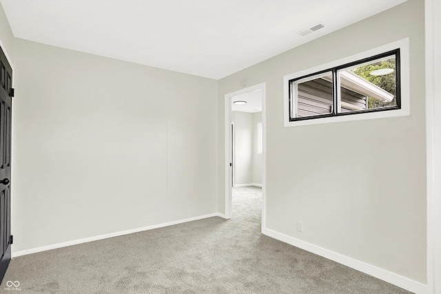 empty room featuring carpet floors