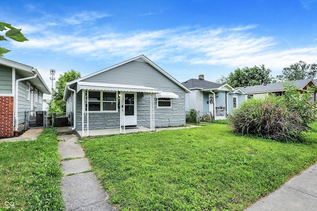 bungalow-style home featuring a front yard