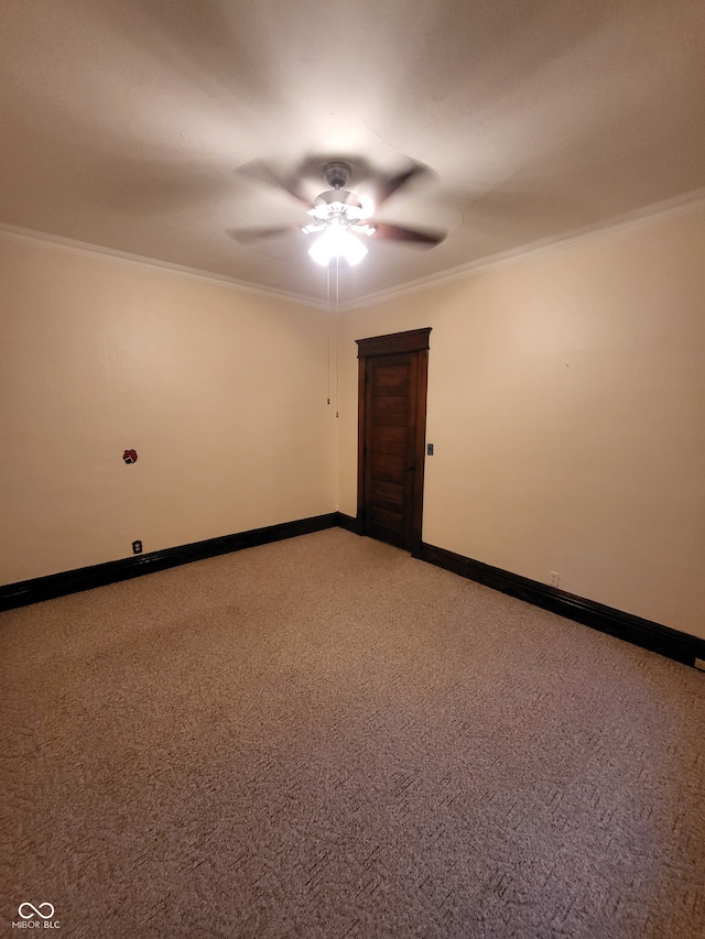 carpeted empty room with crown molding and ceiling fan