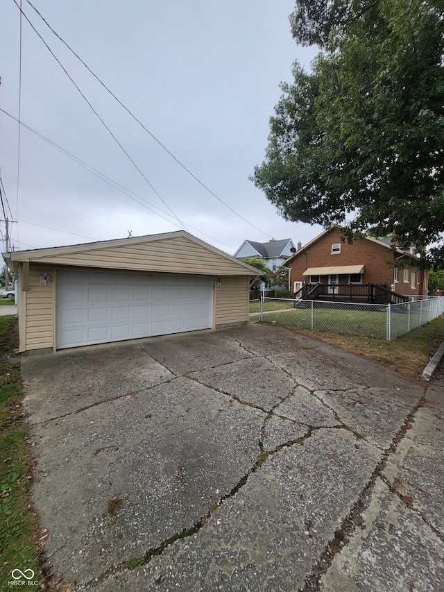 view of property exterior with an outbuilding and a garage