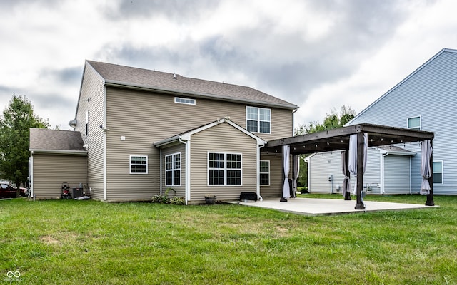 back of house with a pergola, a yard, and a patio