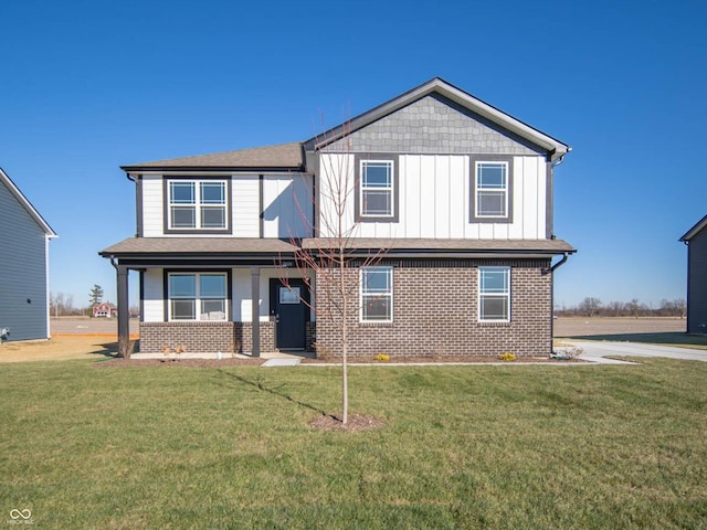 7888 Magnolia St, New Palestine, IN 46163 - view of front of property featuring brick siding, a front yard, covered porch, and board and batten siding