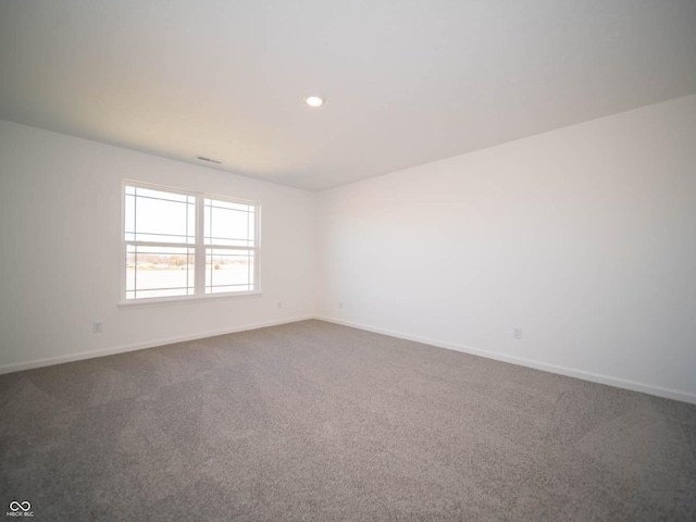 7888 Magnolia St, New Palestine, IN 46163 - carpeted spare room featuring baseboards and recessed lighting