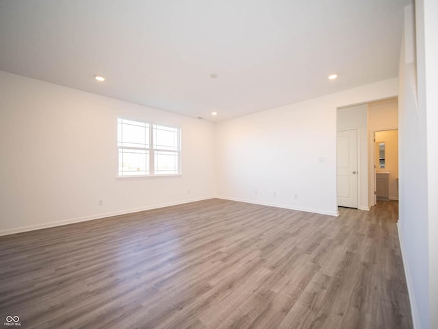 7888 Magnolia St, New Palestine, IN 46163 - empty room with wood finished floors and recessed lighting