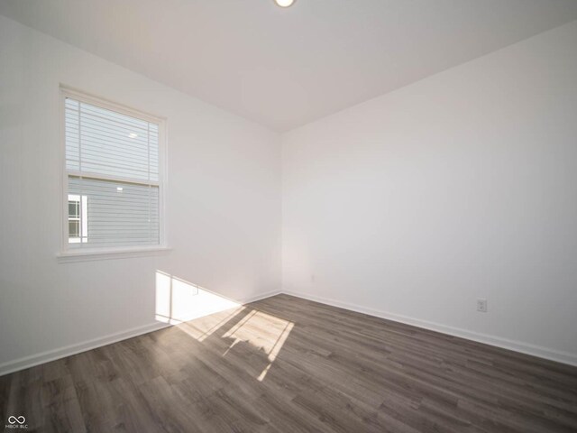 7888 Magnolia St, New Palestine, IN 46163 - empty room with dark wood-type flooring and baseboards