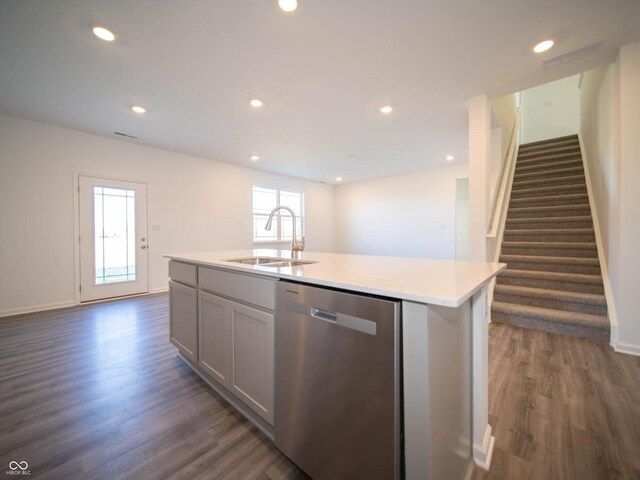 7888 Magnolia St, New Palestine, IN 46163 - kitchen with dishwasher, dark wood-type flooring, light countertops, an island with sink, and recessed lighting