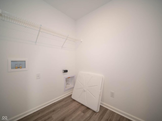 7888 Magnolia St, New Palestine, IN 46163 - washroom featuring washer hookup, wood finished floors, and electric dryer hookup