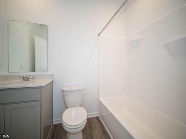 7888 Magnolia St, New Palestine, IN 46163 - bathroom with vanity, wood finished floors, and  shower combination