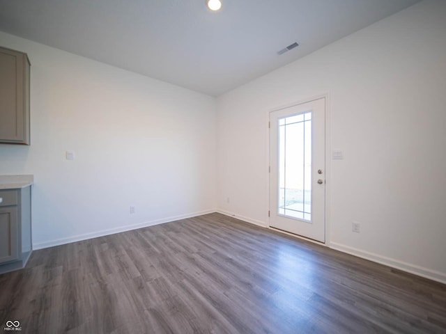 7888 Magnolia St, New Palestine, IN 46163 - unfurnished living room with dark wood-style flooring