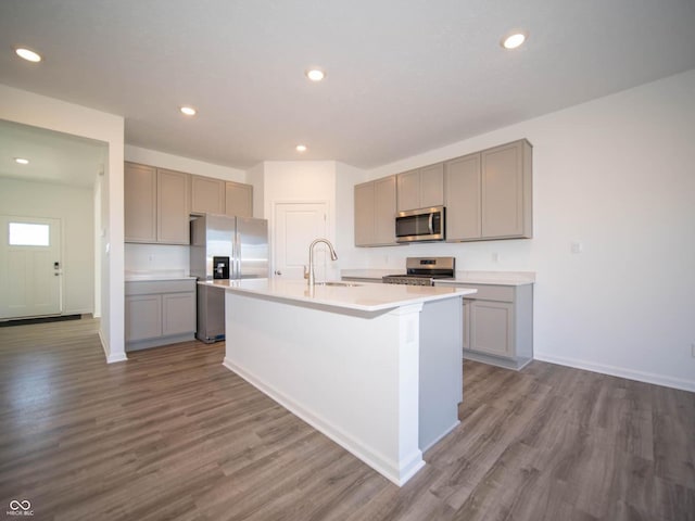 7888 Magnolia St, New Palestine, IN 46163 - kitchen with stainless steel appliances, gray cabinetry, a kitchen island with sink, dark wood-style floors, and recessed lighting
