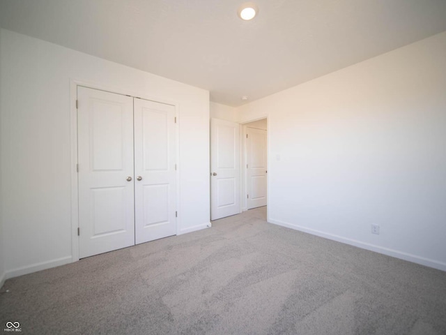 7888 Magnolia St, New Palestine, IN 46163 - unfurnished bedroom featuring carpet flooring and a closet