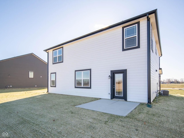 7888 Magnolia St, New Palestine, IN 46163 - back of house featuring a patio and a lawn