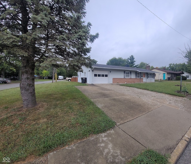 single story home featuring a front lawn and a garage