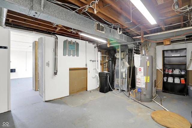 basement with gas water heater and heating unit