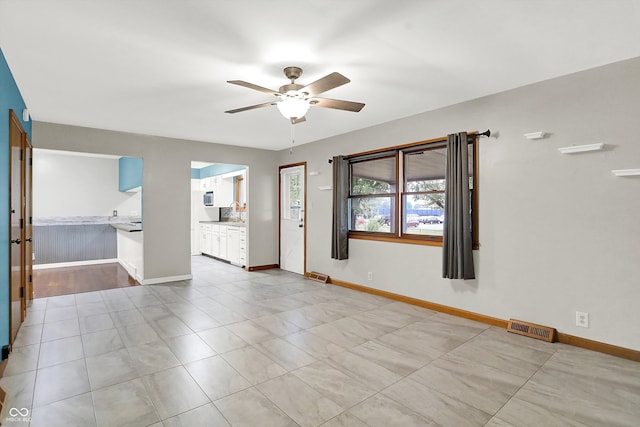 spare room featuring ceiling fan