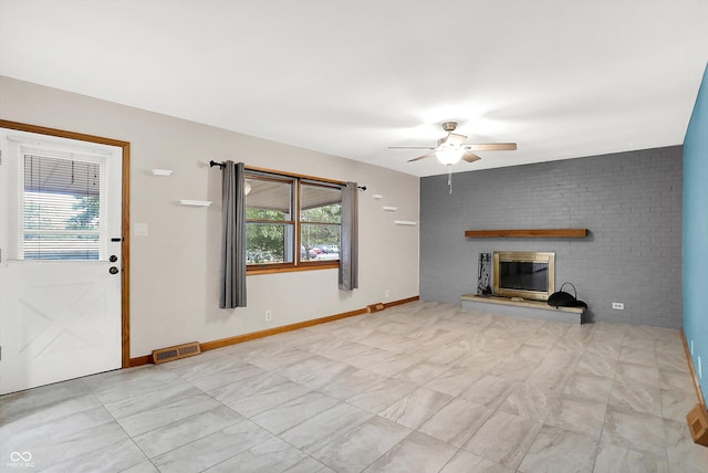 unfurnished living room featuring ceiling fan