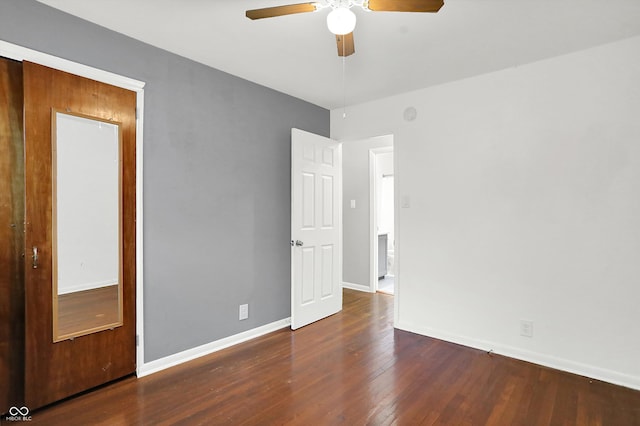 interior space featuring ceiling fan and dark wood-type flooring