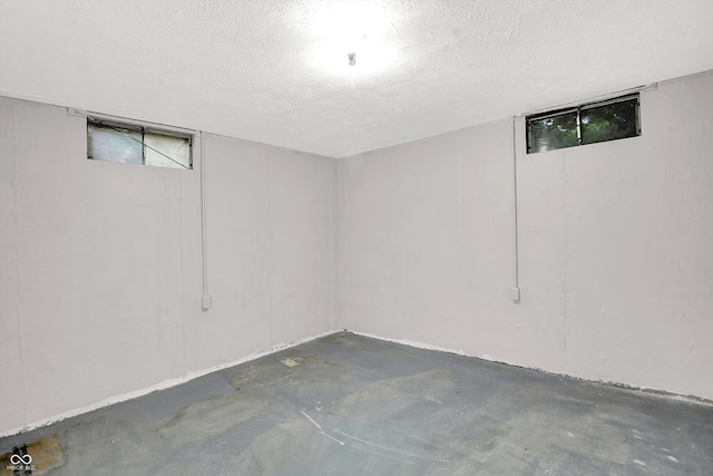 basement with a textured ceiling