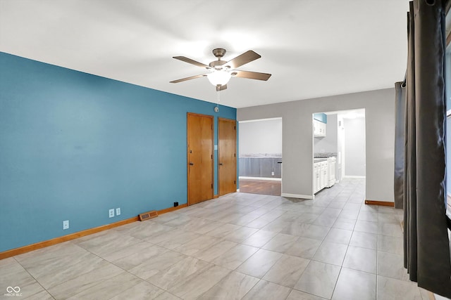 spare room featuring ceiling fan