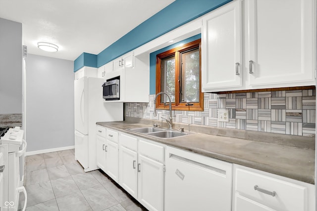 kitchen featuring white cabinets, light tile patterned flooring, sink, white appliances, and decorative backsplash