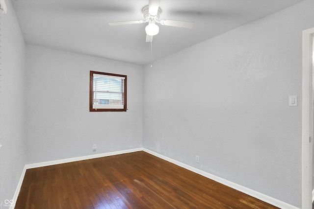 spare room featuring hardwood / wood-style floors and ceiling fan