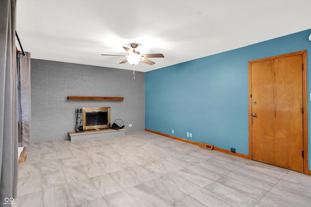 unfurnished living room featuring ceiling fan and a fireplace