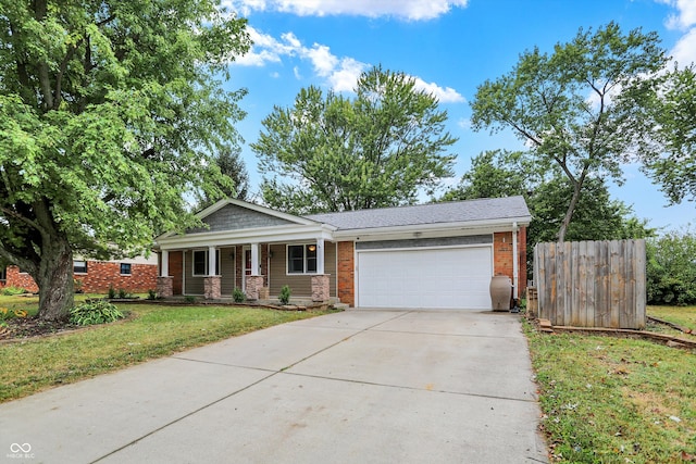 view of front of property featuring a front yard and a garage