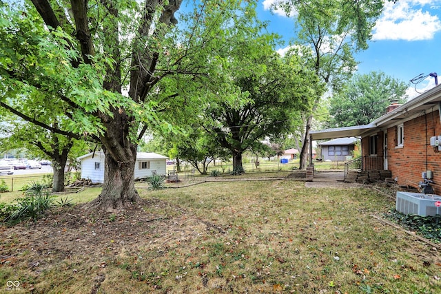 view of yard with central AC