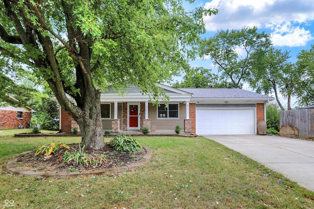 view of front facade featuring a front yard and a garage