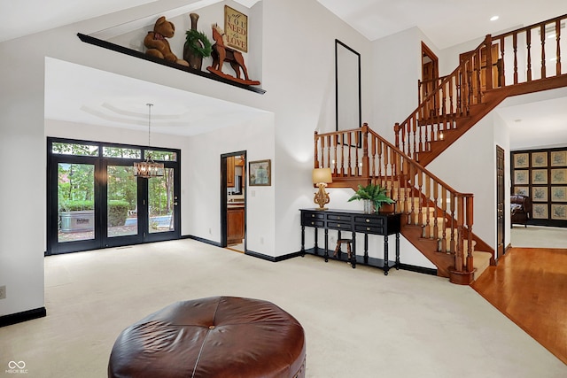 interior space featuring an inviting chandelier and light colored carpet