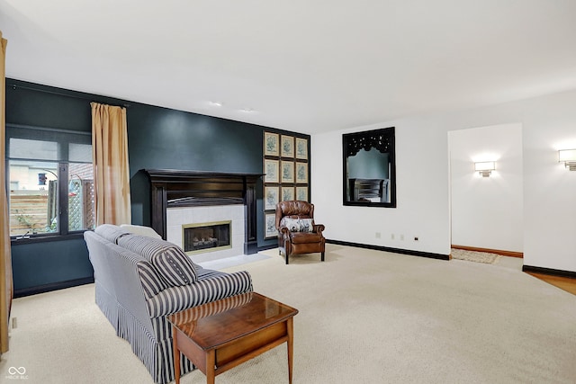 living room with light carpet and a fireplace