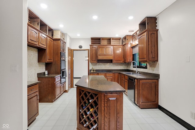 kitchen with black appliances, a kitchen island, sink, and tasteful backsplash