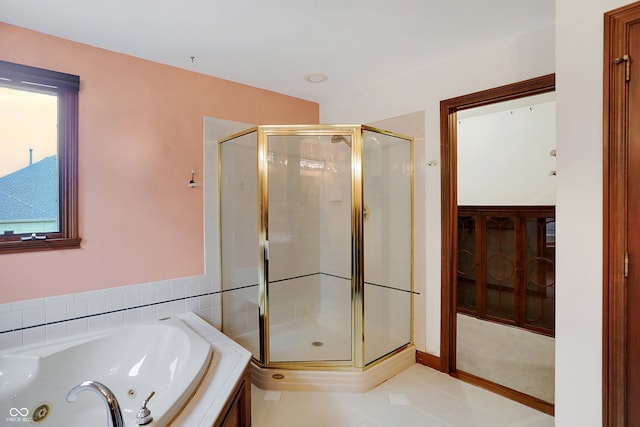 bathroom featuring shower with separate bathtub and tile patterned floors