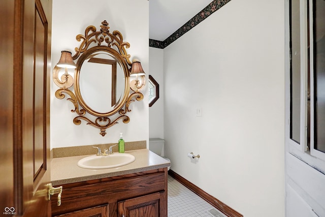 bathroom featuring tile patterned flooring and vanity