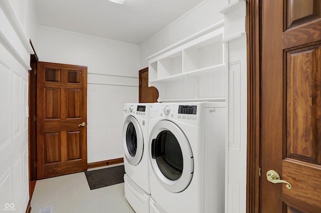 washroom with washing machine and dryer