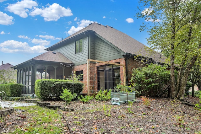 back of property featuring a sunroom