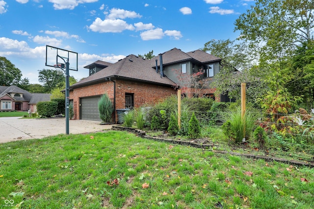 view of home's exterior with a garage and a yard