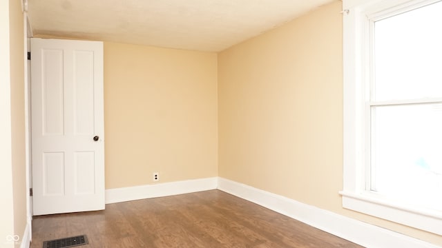 empty room featuring hardwood / wood-style flooring