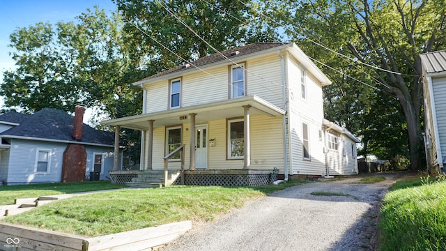 view of front of house with a front lawn and a porch