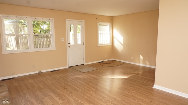 foyer entrance with hardwood / wood-style floors