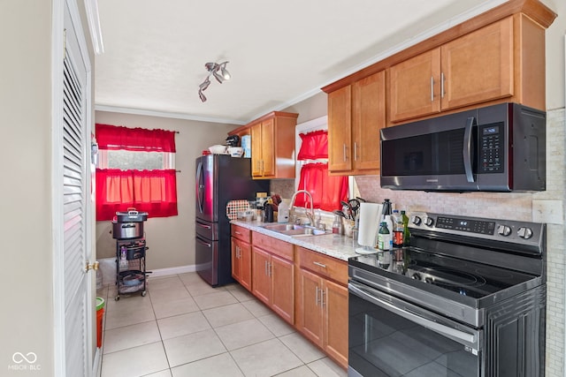 kitchen with decorative backsplash, stainless steel appliances, ornamental molding, sink, and light tile patterned flooring