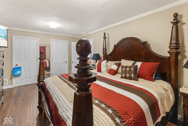 bedroom with ornamental molding, a textured ceiling, and dark hardwood / wood-style floors