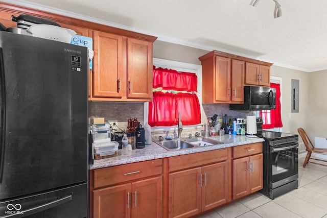 kitchen featuring crown molding, black appliances, sink, and decorative backsplash