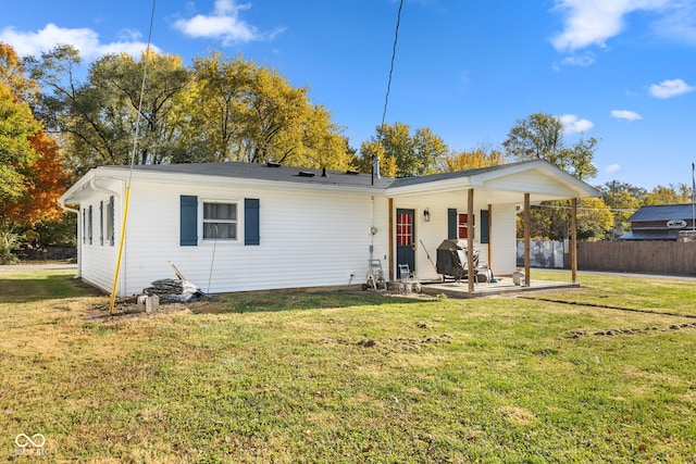 view of front of house featuring a patio area and a front yard