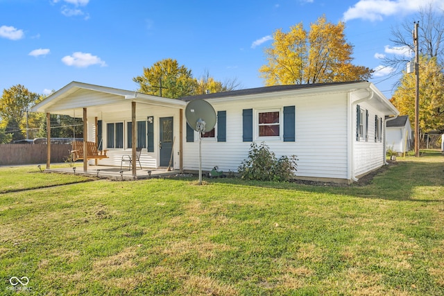 view of front of property with a front lawn and covered porch