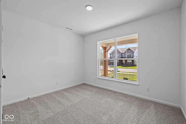 spare room featuring carpet flooring